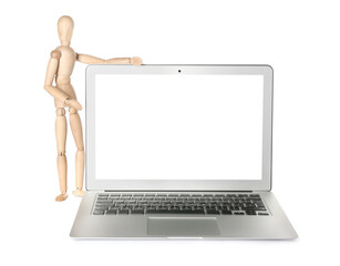 Wooden mannequin with laptop on white background