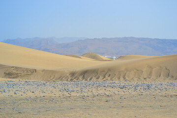 The Maspalomas Dunes are sand dunes located on the south coast of the island of Gran Canaria
