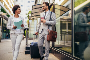 Business people go to business trip. Man pulling his suitcase.
