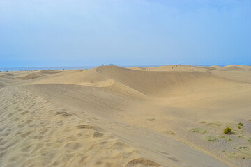 Fototapeta na wymiar The Maspalomas Dunes are sand dunes located on the south coast of the island of Gran Canaria