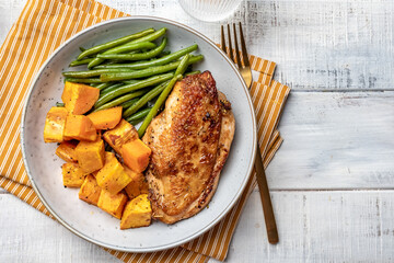 Grilled chicken breast, fillet with sweet potato or pumpkin and green beans, healthy food, top view