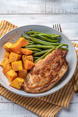 Grilled chicken breast, fillet with sweet potato or pumpkin and green beans, healthy food, top view