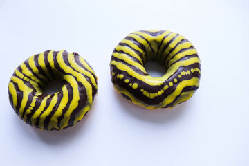 sweet dessert. round donut with chocolate icing and a cup of coffee