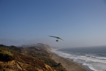 Fototapeta na wymiar paraglider over the sea