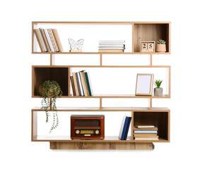 Shelving unit with books and decor on white background