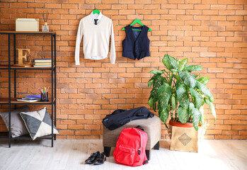 Stylish school uniform in interior of room