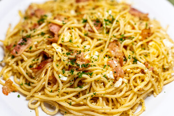 Selective focus on a dish of spaghetti carbonara