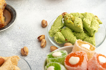 Fototapeta na wymiar Close up of colorful Turkish halva sweets on gray surface