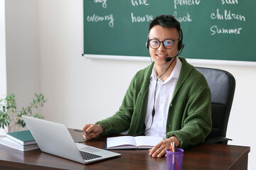 Asian teacher conducting English lesson online