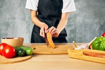Cook woman lunch at home vegetarian food cutting board