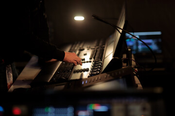 light board operator works at the control panel