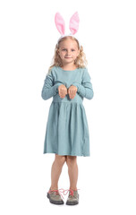 Cute little girl with bunny ears on white background