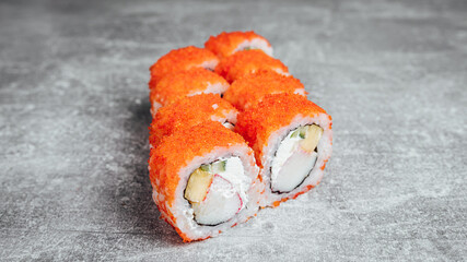 Golden Surimi sushi rolls on stone texture table