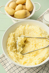 Bowl with tasty mashed potatoes on table