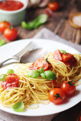 Italian pasta spaghetti with basil and cherry tomatoes