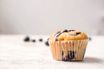 Tasty blueberry muffin on table