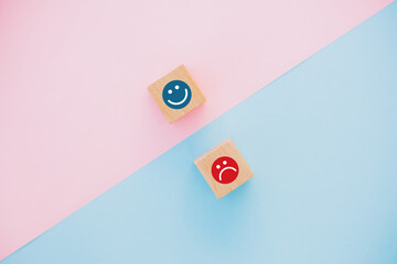 smiley face and sad face icon on wooden cube, Service rating, satisfaction concept