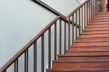 wooden stair and steel handrail.