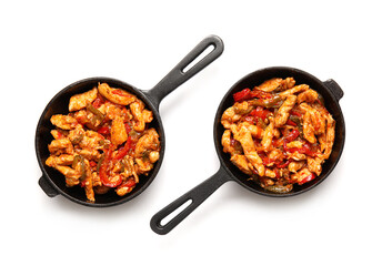 Frying pans with tasty Fajita on white background