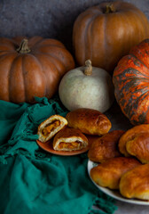 Pumpkin patties. Autumn food. You are on the table. A treat for Halloween. Still life. Sweet pastries with filling. Pie.