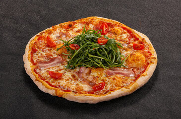 Pizza with bacon and rucola