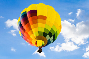 European hot air balloon festival. Hot air balloon flight over blue sky