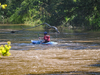 Red Kayak Close To Snag