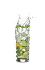 Glass of splashing lemonade on white background