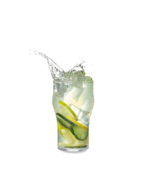 Glass of splashing lemonade on white background