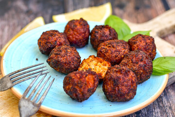 Home made deep fried   mini  fish and vegetables meatballs ,on  rustic background