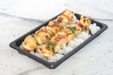 turkey skewer and rice condiment