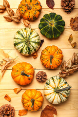 Obraz na płótnie Canvas Autumn composition with pumpkins on wooden background, closeup