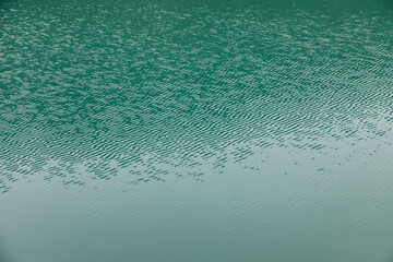Close up of the turquoise water of a lake.