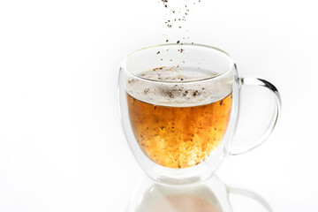 instant coffee is poured into a transparent mug