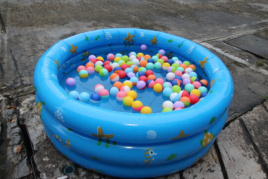 Colored Balls Used To Scoop Sweepstakes To Win Prizes Written Inside.