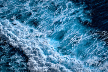 Aerial view to waves in ocean Splashing Waves. Blue clean wavy sea water.