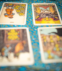 Psychic readings and clairvoyance concept - Fortune teller with hands hold retro Tarot cards.  Reading tarot divination