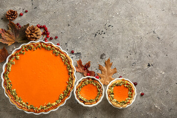 Obraz na płótnie Canvas Autumn composition with pumpkin pies on grunge background