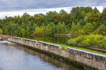 Fototapeta premium View of the picturesque river and wooded autumn coast
