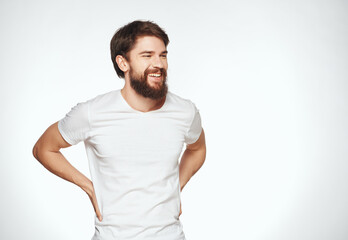 bearded man in a white t-shirt expressive look discontent Studio