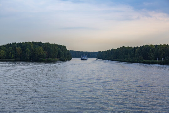 View of the picturesque river and wooded autumn coast