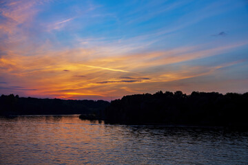 Obraz premium View of the picturesque river and wooded autumn coast