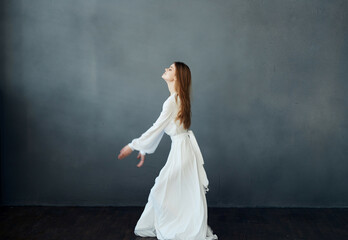 Fototapeta na wymiar cheerful Woman in white dress dance elegant style luxury romance