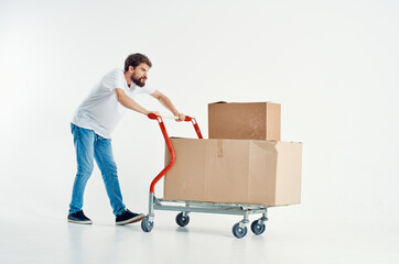 Cheerful man shipping transport in a box isolated background