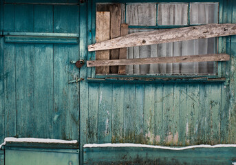 The lock on the doors of the old barn.