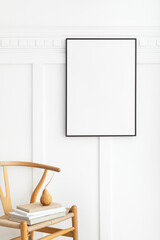 Blank picture frame hanging above a classic wooden