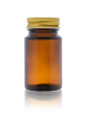 Empty medical bottle made of dark brown glass, closed with a metal lid. Isolated on a white background with reflection