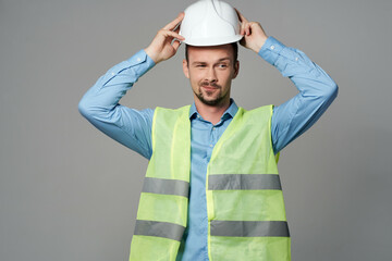 man reflective vest protection Working profession light background
