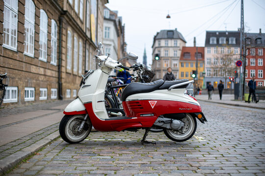 Copenhagen, Denmark - Novemeber 12, 2020: Side view of a Peugeot Django scooter in the city centre