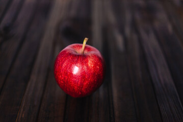 red apple on wooden background